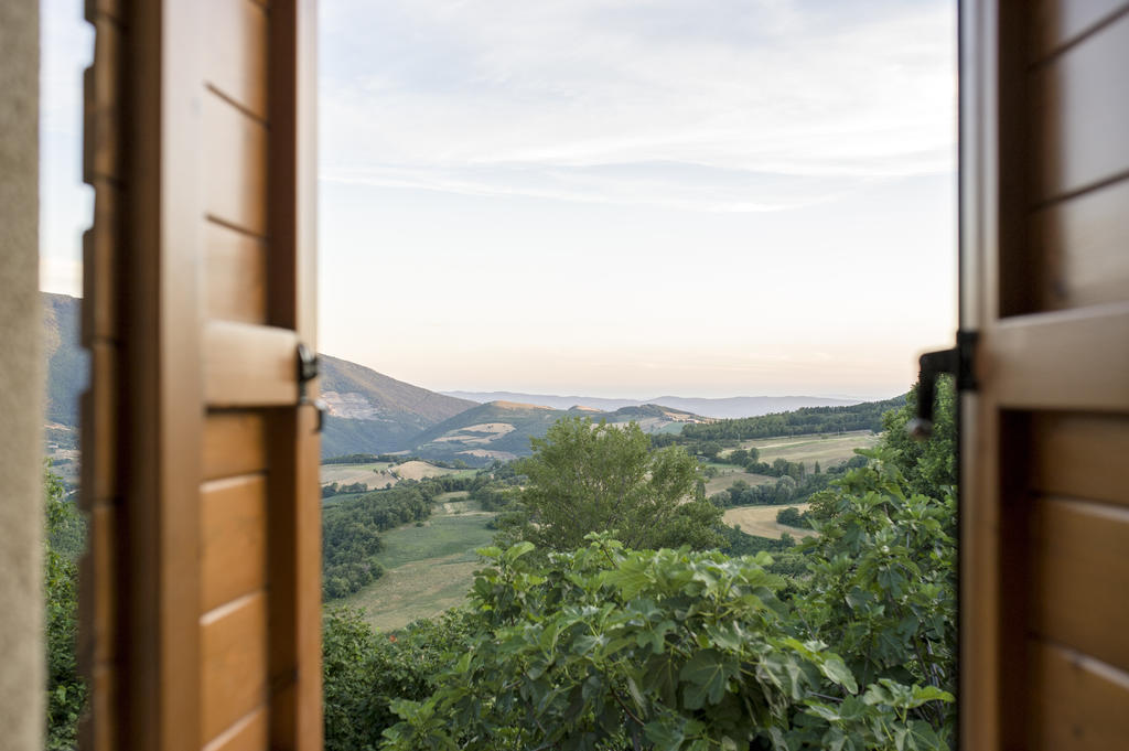 Bed and breakfast Le Ginestre Assise Chambre photo